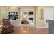 Inviting living room with hardwood floors, coffee bar, and a cozy sunroom area at 891 Berryman Pl, Lawrenceville, GA 30045