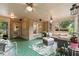 Inviting screened-in porch featuring comfortable seating and an inviting view of the backyard at 891 Berryman Pl, Lawrenceville, GA 30045