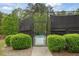 Community tennis court entrance with well-maintained landscaping at 891 Berryman Pl, Lawrenceville, GA 30045
