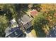Aerial view showcases property, mature trees, and neighboring homes in a residential neighborhood at 1384 Allegheny Sw St, Atlanta, GA 30310