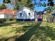 The home has a well-maintained lawn and landscaping, enhancing the property's curb appeal and outdoor living space at 1384 Allegheny Sw St, Atlanta, GA 30310