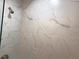 Bathroom shower featuring stylish white marble tile and modern fixtures at 1384 Allegheny Sw St, Atlanta, GA 30310
