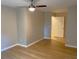 Neutral bedroom with hardwood floors, a ceiling fan, and natural light at 1384 Allegheny Sw St, Atlanta, GA 30310