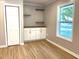 Bright bedroom features wood flooring, white cabinets with wood countertop, and a window for natural light at 1384 Allegheny Sw St, Atlanta, GA 30310