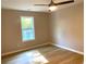 Bright bedroom featuring hardwood floors, neutral paint and ceiling fan at 1384 Allegheny Sw St, Atlanta, GA 30310