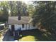 Charming single-story home with a well-maintained lawn, mature trees, and inviting curb appeal at 1384 Allegheny Sw St, Atlanta, GA 30310