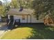 Charming single-story home with a well-maintained lawn, mature trees, and inviting curb appeal at 1384 Allegheny Sw St, Atlanta, GA 30310