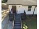Inviting front entrance with freshly painted stairs, walkway, and door with security features at 1384 Allegheny Sw St, Atlanta, GA 30310