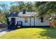 Charming home featuring a well-maintained lawn, classic curb appeal, and inviting front entry at 1384 Allegheny Sw St, Atlanta, GA 30310