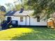 Charming home featuring a well-maintained lawn, classic curb appeal, and inviting front entry at 1384 Allegheny Sw St, Atlanta, GA 30310