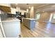 Modern kitchen with stainless appliances, white cabinets, quartz countertops, and a stylish island at 1384 Allegheny Sw St, Atlanta, GA 30310
