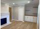 Bright living room features a fireplace, built-in cabinets and drawers, and hardwood flooring at 1384 Allegheny Sw St, Atlanta, GA 30310