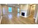 Spacious living room with wood flooring, fireplace, and plenty of natural light from multiple windows at 1384 Allegheny Sw St, Atlanta, GA 30310