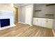 Bright living room features a fireplace, built-in cabinets and drawers, and hardwood flooring at 1384 Allegheny Sw St, Atlanta, GA 30310