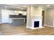 Open-concept living room and kitchen with wood floors and modern finishes at 1384 Allegheny Sw St, Atlanta, GA 30310
