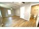Main bedroom with wood floors, ensuite bathroom, and one ceiling fan with lots of natural light at 1384 Allegheny Sw St, Atlanta, GA 30310