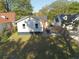 Aerial view of rear exterior, showcasing backyard, driveway, and fresh white paint at 1384 Allegheny Sw St, Atlanta, GA 30310