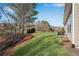 Lush backyard with healthy green lawn and tree line at 4410 Chaney Ct, Cumming, GA 30028