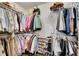 Walk-in closet featuring shelving and clothing racks for organized storage at 4410 Chaney Ct, Cumming, GA 30028