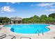 Inviting community pool with lounge chairs and umbrellas, perfect for relaxing on sunny days at 4410 Chaney Ct, Cumming, GA 30028