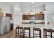 Spacious kitchen with a granite island, stainless steel appliances, and pendant lighting at 4410 Chaney Ct, Cumming, GA 30028
