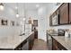 Well-lit kitchen with granite countertops, stainless steel appliances, and ample cabinet space at 4410 Chaney Ct, Cumming, GA 30028