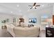 Spacious living room with neutral paint, hardwood floors, and a cozy seating area at 4410 Chaney Ct, Cumming, GA 30028