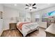 Well-lit main bedroom featuring hardwood floors, neutral walls, and coordinated furnishings at 4410 Chaney Ct, Cumming, GA 30028