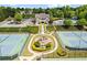 Aerial view of community amenities featuring a pool, tennis courts, playground, and clubhouse at 6170 Weddington Dr, Cumming, GA 30040