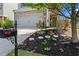 Landscaped front yard with flower beds and a mailbox showcasing curb appeal at 6170 Weddington Dr, Cumming, GA 30040