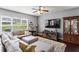 Comfortable living room with a large sectional, soft rug, and natural light, perfect for relaxation at 6170 Weddington Dr, Cumming, GA 30040