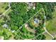 Expansive property featuring residence, pool and surrounded by dense tree coverage and bordered by a road at 65 Maude White Rd, Kingston, GA 30145