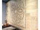A detailed floral pattern is featured on the backsplash of this kitchen range at 65 Maude White Rd, Kingston, GA 30145