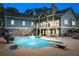 Impressive backyard pool area with slide, diving board, and multi-level patio perfect for relaxing and entertaining at 65 Maude White Rd, Kingston, GA 30145