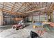Large barn interior, showing work tables, storage, and a lawn mower at 65 Maude White Rd, Kingston, GA 30145