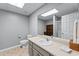 Well-lit bathroom featuring a vanity, toilet, mirror, and shower stall at 65 Maude White Rd, Kingston, GA 30145