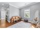 Bright bedroom features hardwood floors, a large area rug, and neutral wall color at 65 Maude White Rd, Kingston, GA 30145