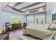 Spacious main bedroom with tray ceiling, hardwood floors, and double doors leading to a private balcony at 65 Maude White Rd, Kingston, GA 30145