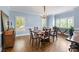 Elegant dining room with hardwood floors, wainscoting, and natural light at 65 Maude White Rd, Kingston, GA 30145