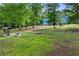 Beautiful house and lawn, with an outdoor grill and seating area at 65 Maude White Rd, Kingston, GA 30145
