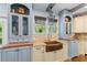 Charming kitchen with custom cabinets, copper sink, and designer fixtures at 65 Maude White Rd, Kingston, GA 30145