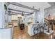 Gourmet kitchen with custom cabinetry, hardwood floors, stainless steel appliances, and bar seating at 65 Maude White Rd, Kingston, GA 30145