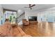 Spacious living room with hardwood floors, a staircase, and ample natural light at 65 Maude White Rd, Kingston, GA 30145