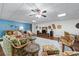 Large living room featuring comfortable couches, ceiling fan, and decorative accent pieces at 65 Maude White Rd, Kingston, GA 30145