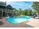 Spacious pool area with slide, water fountains, and surrounding greenery at 65 Maude White Rd, Kingston, GA 30145