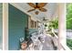 Cozy porch seating area with ceiling fans and lush greenery at 65 Maude White Rd, Kingston, GA 30145