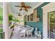 Inviting front porch with wicker furniture and hanging plants at 65 Maude White Rd, Kingston, GA 30145