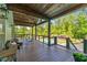 Expansive outdoor porch overlooking a beautiful backyard and pool area, perfect for relaxing and entertaining at 65 Maude White Rd, Kingston, GA 30145