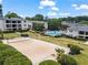 Aerial view of community featuring pool, volleyball court, and greenery at 1150 Collier Nw Rd # K18, Atlanta, GA 30318