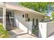 A well-maintained condo exterior with stairs leading to upper units and gated access at 1150 Collier Nw Rd # K18, Atlanta, GA 30318